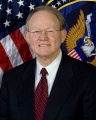 480px-Mike McConnell, official ODNI photo portrait.jpg